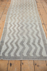Distressed vintage Turkish Tulu runner: ivory and beige chevron pattern with pile wear.