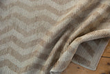 Textured pile of vintage Tulu rug runner, showing wear and ivory beige chevron.