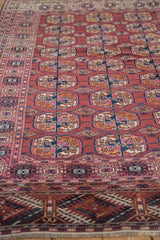 Vintage Turkmen rug's intricate geometric borders and 