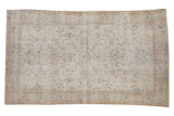 Distressed hand-knotted Sparta rug, allover scrolling vinery in ivory, beige, and pale blue.