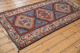 Vintage Hamadan rug featuring geometric stepped medallion, triangular, and hook-and-latch details.
