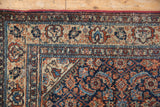 Vintage Malayer rug corner, navy, red, ivory Herati motif with worn pile exposing foundation.