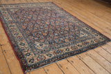 Vintage Malayer rug corner: Herati pattern, antique ivory border, and exposed end foundation.
