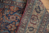 Vintage Malayer rug, worn navy and red Herati pile revealing knot heads, tight beige foundation.
