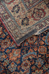Malayer rug's woven foundation with red selvedge and black velcro strip.