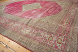 Distressed raspberry red Doroksh carpet, featuring faded texture and Samovar Turtle border.