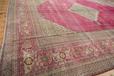 Distressed raspberry Persian Doroksh rug with Herati and Samovar Turtle border motifs.