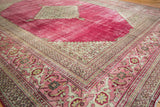 Distressed Persian Doroksh rug with ruby red field, intricate blush and ivory pawn and turtle borders.