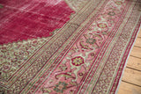 Distressed borders of a vintage Doroksh carpet with Samovar Turtle design in blush, ivory, and crimson.
