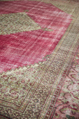 Distressed raspberry red field with intricate Samovar Turtle and pawn motif borders in light tones.