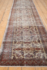 Distressed ivory Kaisery runner detail, Herati motif, and traditional red border.