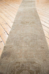 Distressed Oushak runner texture, showing subtle abrashed field with faded medallions.