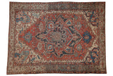 Distressed Serapi rug, geometric medallion, abrashes in rust, navy, and ivory. 9'7