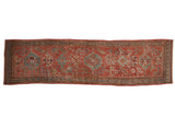 Vintage Distressed Oushak runner featuring ruby red, pale blue floral patterns and intricate borders.