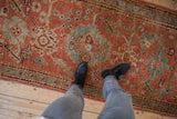 Distressed vintage Oushak runner, muted coral, pale blue, saffron yellow botanical patterns.