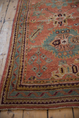 Distressed Oushak runner border detail with zig-zag motifs and textured ruby and sky blue pile.