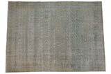 Distressed Meshed carpet with allover pale blue germinating paisley design on an ivory field.