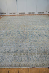 Detailed view of distressed Meshed rug, showing worn knot heads and blue paisley.