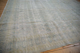Distressed vintage Meshed rug with foundation exposed, featuring pale blue boteh paisley pattern.