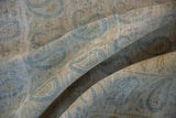 Distressed vintage Meshed carpet, highlighting pale denim blue paisley on antique ivory with visible foundation.