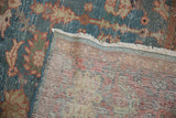 Vintage distressed Mahal carpet pile with denim blue floral design and visible hand-knotted reverse.