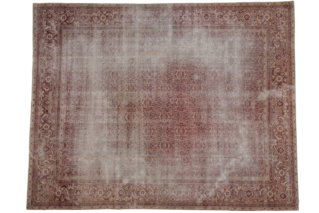 Antique distressed Amritsar carpet featuring faded dusty raspberry and ivory Mahi Mahi Herati design.