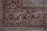 Distressed antique Amritsar carpet, raspberry and beige Mahi Mahi Herati with serrated leaves.
