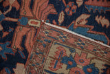 Antique Heriz carpet pile with wear, visible foundation, intricate border, and side selvage.