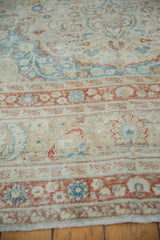 Vintage distressed Meshed carpet detail: low pile, muted terracotta, blue, ivory floral patterns.