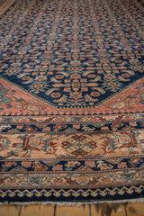 Low angle over the detailed borders and repeating Herati field of a vintage Lilihan carpet.