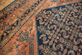 The navy blue Herati field meets the intricate dusty blush border of a fine Persian Lilihan carpet.