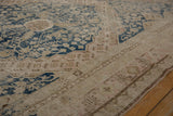 Distressed Khotan runner, dusty navy floral and pawn motif border, exposed foundation.