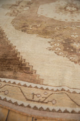 Distressed Oushak rug texture with stepped beige and coffee brown motif.