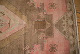 Distressed Oushak rug detail: blush and brown geometric, crab style floral motifs, abrash.