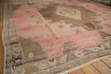 Distressed vintage Oushak rug, blush and brown geometric patterns with abrashes.