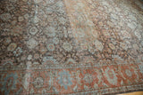 Distressed Mahal carpet corner, with faded rust, powder blue Herati palmettes.