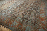 Vintage Mahal carpet's serrated leaf Herati-inspired main border with rust, dusty blue palmettes.