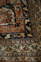 Vintage Tabriz carpet corner: Herati design, Samovar border in navy, rust, and ivory.