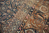 Vintage Tabriz carpet's navy, rust, ivory Herati and Samovar patterns.