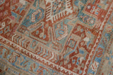 Distressed Karaja runner with geometric contours, hook and latch relief, time-softened tones.
