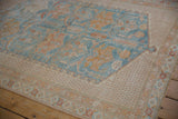 Distressed vintage Afshar rug's powder blue and pale gold floral cross sections and even wear.