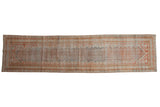 A distressed vintage Persian Mahal runner with a diamond boteh design in soothing rust and ocean blue tones.
