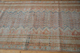 Close view of the distressed, low-pile texture on a vintage Mahal runner showing its hand-knotted foundation.