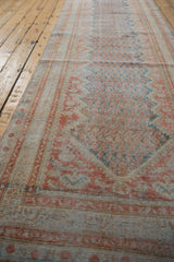 Angled view down the distressed Persian Mahal runner showing its time-softened texture and even wear.