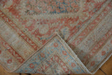 Corner of a distressed Mahal runner, flipped to reveal its hand-knotted back and worn pile.