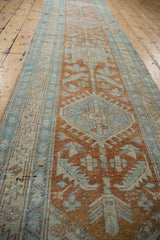 Distressed texture and geometric floral pinwheel motifs in pale terra cotta and powder blue.