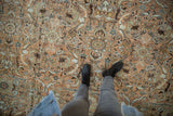 Distressed Mahal carpet pile showing faded floral leaves, palmettes, and dusty rose hues.