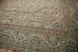Distressed Mahal carpet border with Safavid-inspired dragon motif and sandalwood floral field.