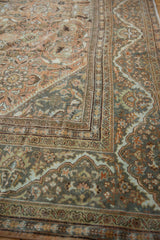 Distressed vintage Mahal rug border with Safavid-era meandering dragon motif and floral fills.