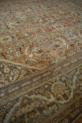 Worn floral field of distressed Mahal carpet meets slate dragon motif border.